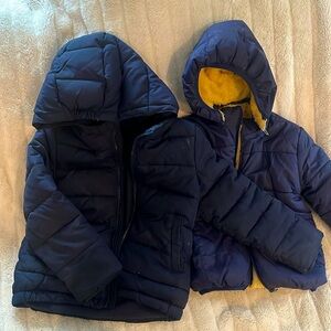 Dark blue toddler/kid puffer jackets (2). Both are size 4-5